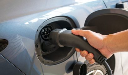 Man,About,To,Charge,His,Electric,Car.,Close,Up,View